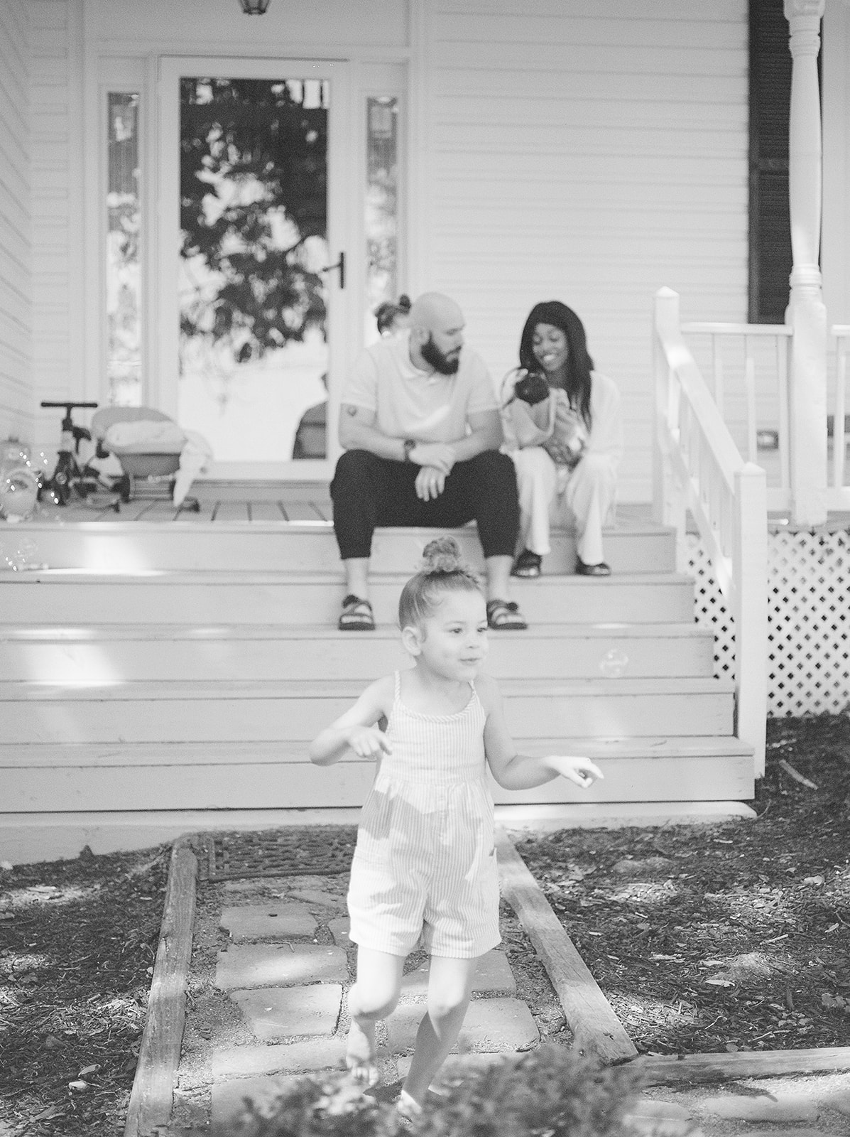 Film family photos of a mother, father, and two daughters