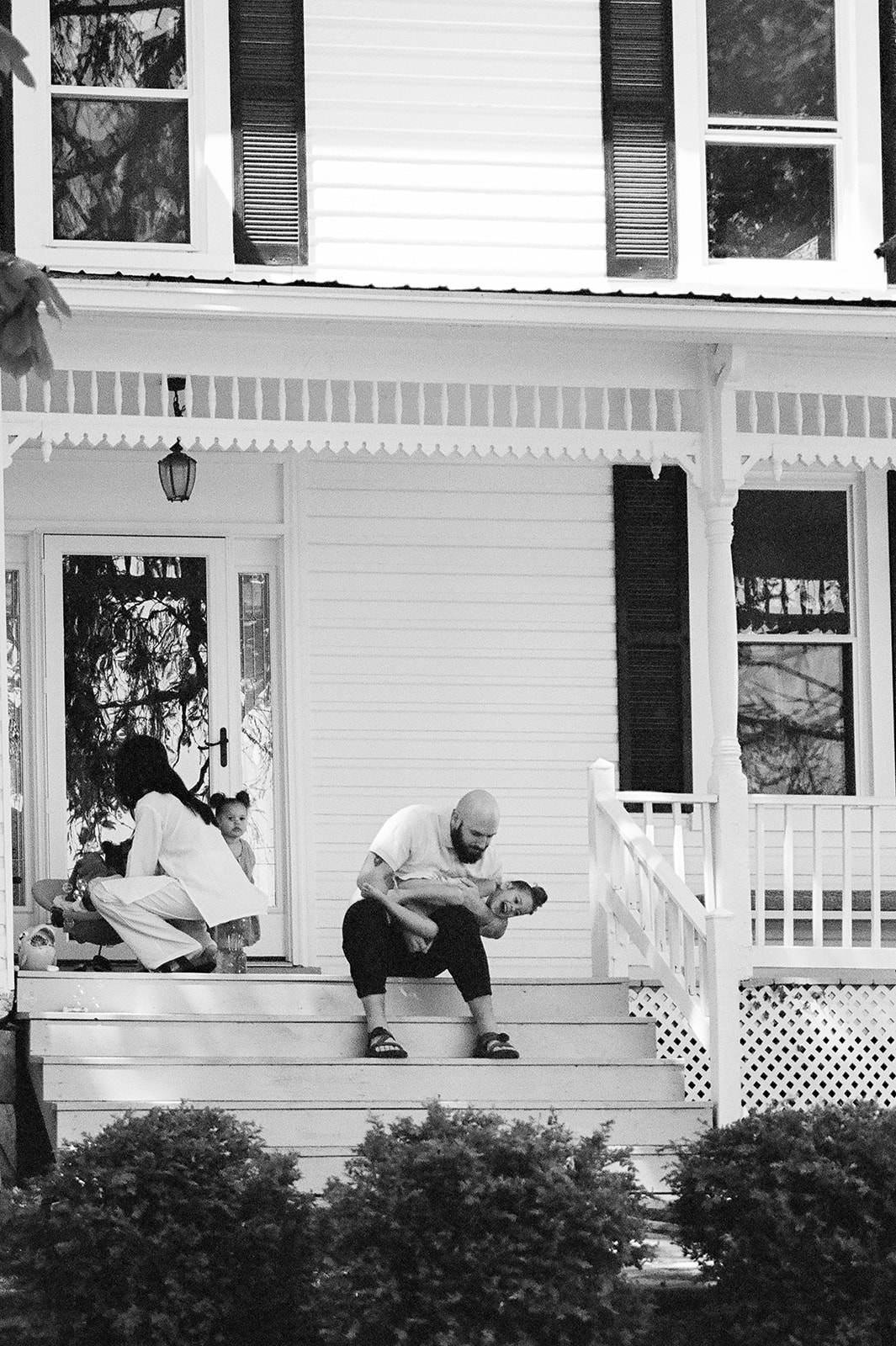 A dad holding his daughter