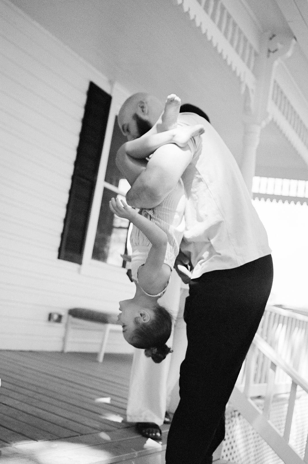 A dad playing with his daughter outside their West Virginia home