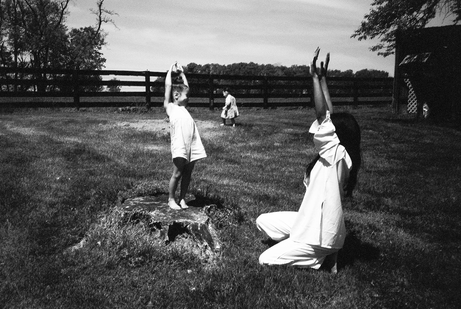 A mother and daughter play outside