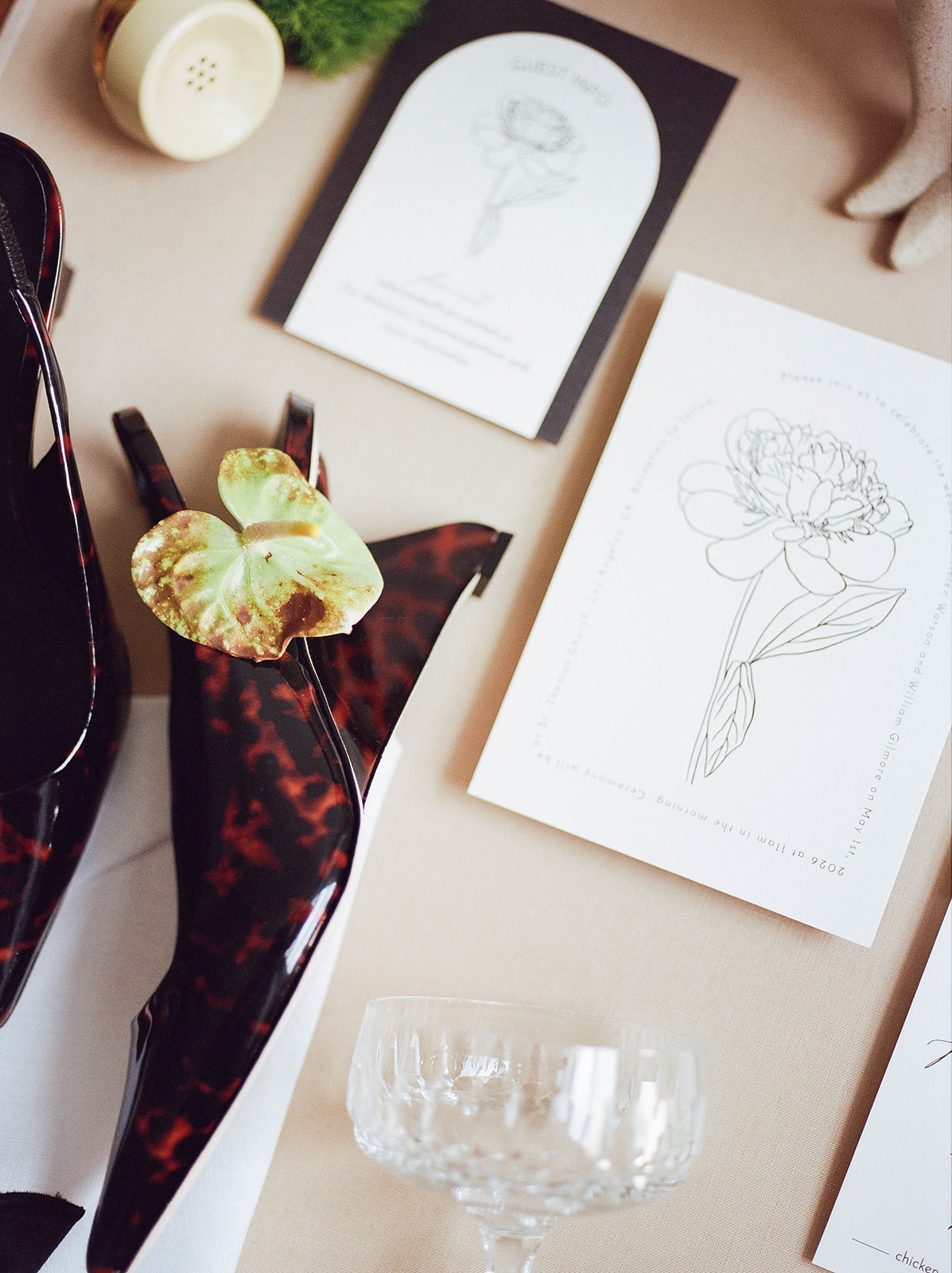 Leopard style sling-back wedges as part of flat lay