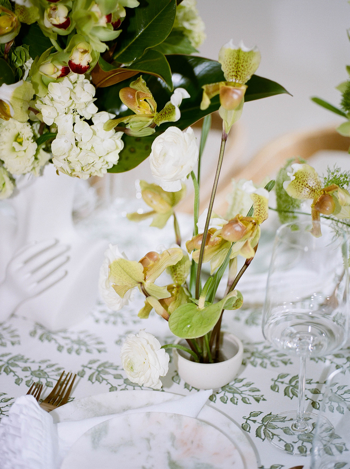 Abstract floral arrangements on a printed linen tablecloth