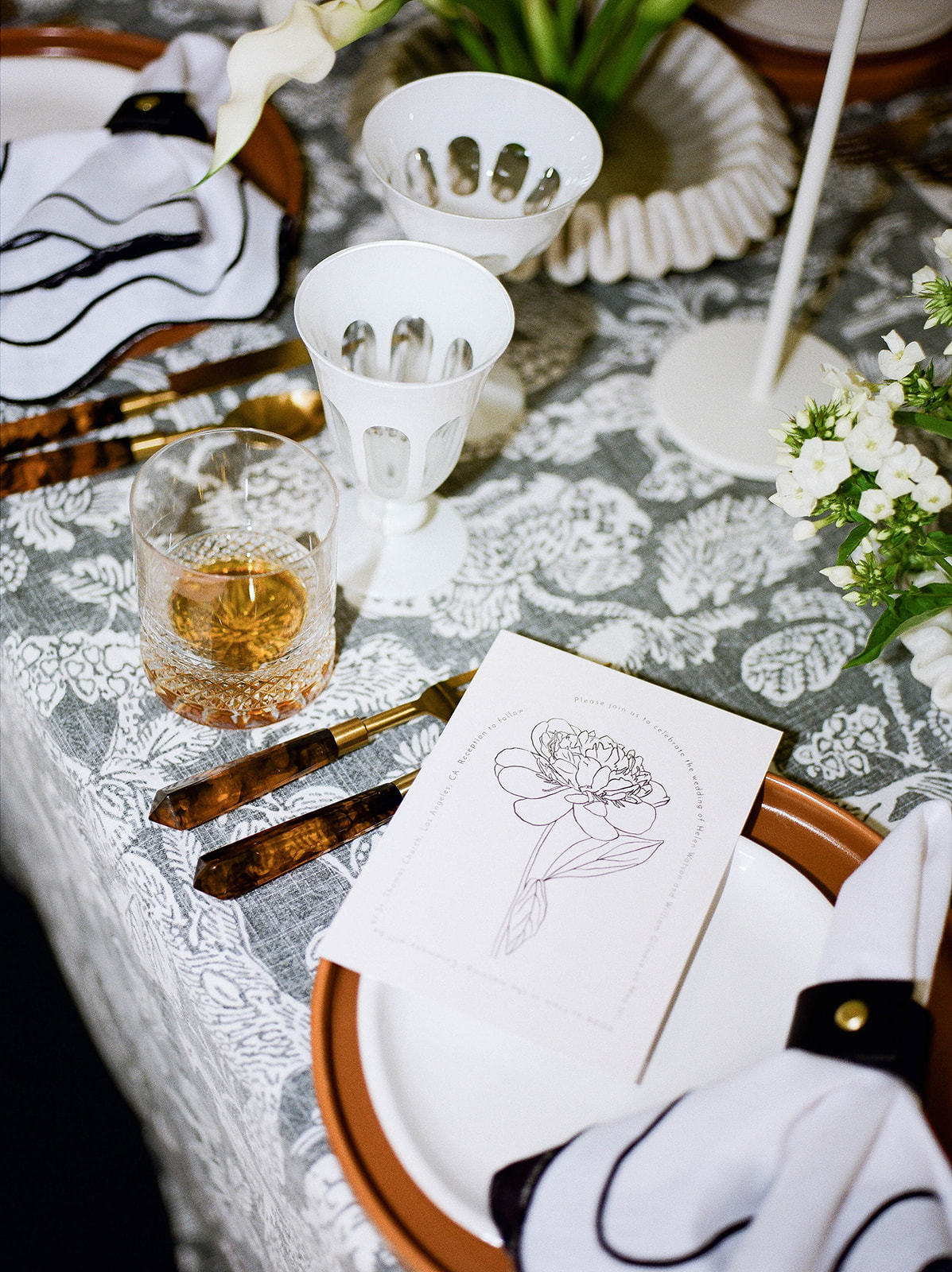 White glassware on a tablescape set by Margot & Co.