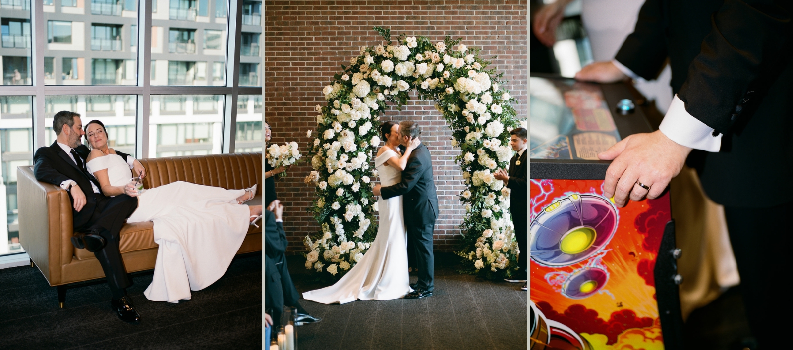 A bride and groom kiss beneath an arch of greenery and roses at a hotel wedding venue in DC