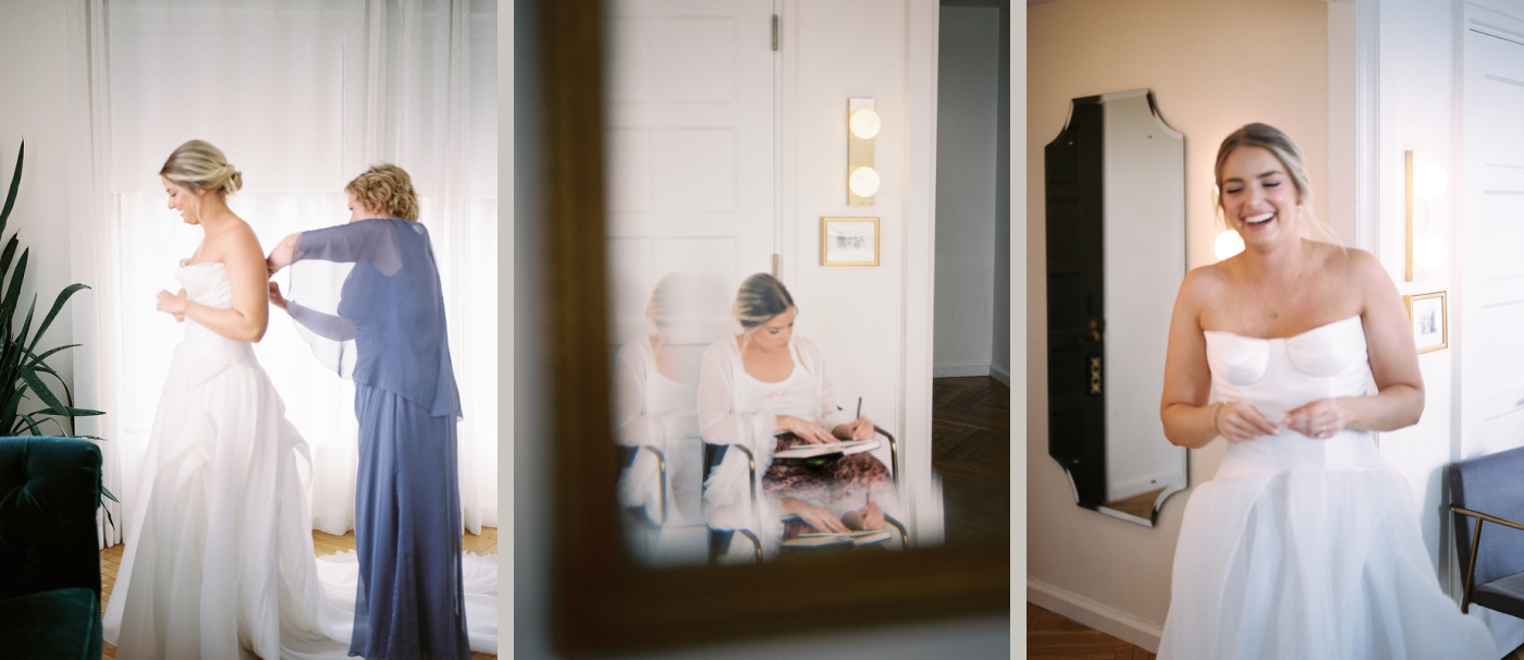 The mother of the bride zips up the bride's strapless, white wedding dress