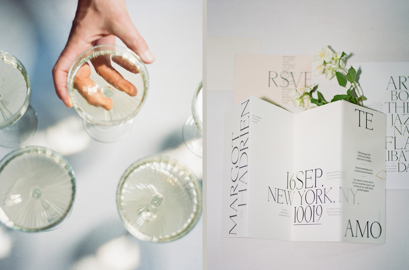 A hand reaches out to hold a glass of champagne from a white table