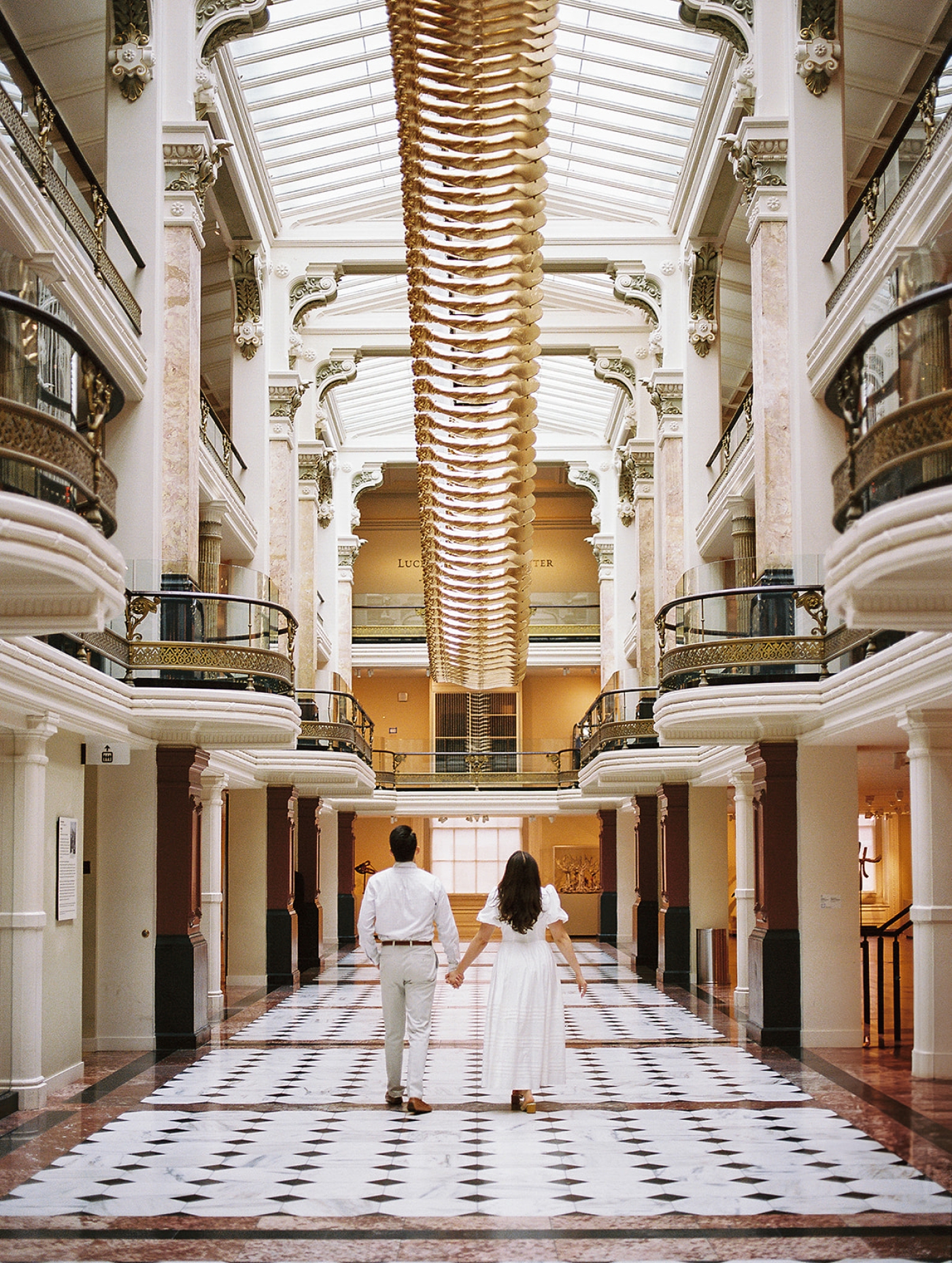 Engagement photos in the great hall of the National Portrait Gallery in Washington, DC
