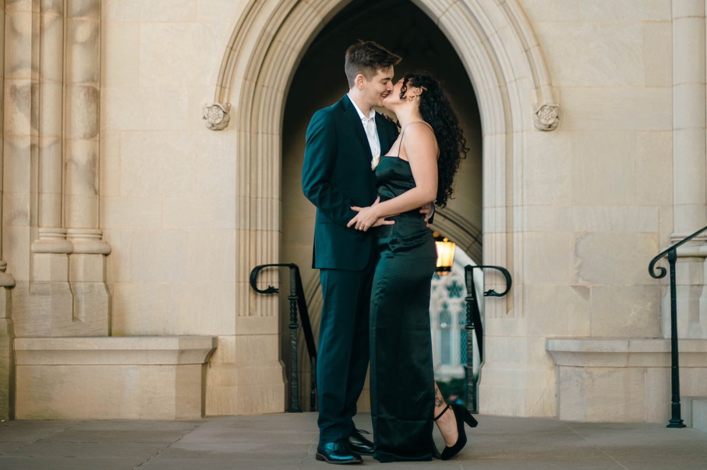 A man and woman embrace at the National Cathedral 